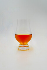A whisky tasting glass isolated against a white background.