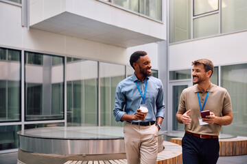 Happy entrepreneurs communicating on their coffee break at work.