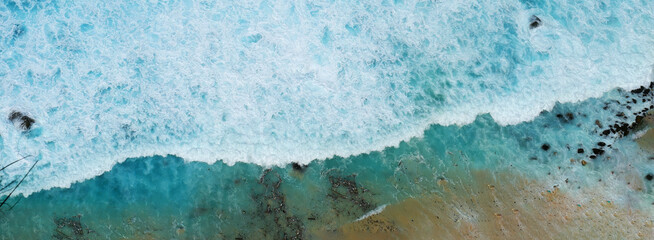 Banner Turquoise ocean sea water white wave pattern splashing deep blue sea. Banner Tropical sea...