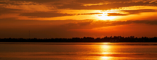 Banner Golden sky sunrise dramatic beautiful landscape view. Dawn sky gold dusk time cloudscape with sunlight. Panorama Dramatic sunset scenic landscape. Beautiful landscape nature with copy space