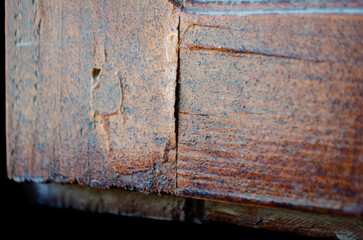 Weathered wooden beam showcasing aged texture and rustic charm makes a striking abstract background element.
