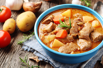 Canadian stew - soup The basis is potatoes and carrots, white mushrooms and onions, beef tenderloin, tomato paste, garlic, spices (bay leaf, rosemary, ground black pepper) are added.