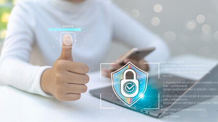 Close-up of a person using fingerprint scanning technology on their thumb for secure login,
