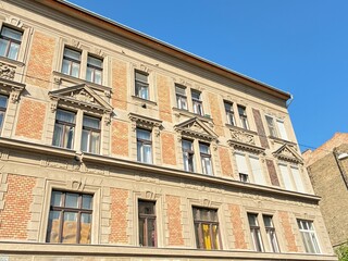 Old urban brick building facade.