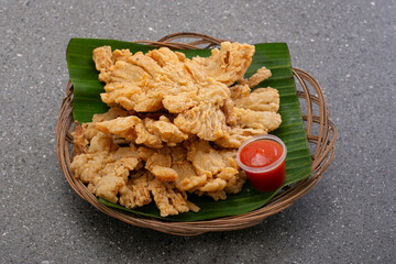 Indonesian street food crispy fried mushrooms with spicy tomato sauce
