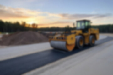 Blurry photo of the construction process of repairing/paving the highway using modern tools.