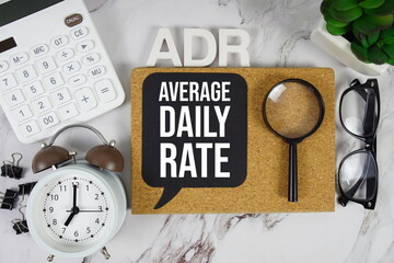 ADR Average Daily Rate acronym with calculator, alarm clock and magnifying glass, Business concept...
