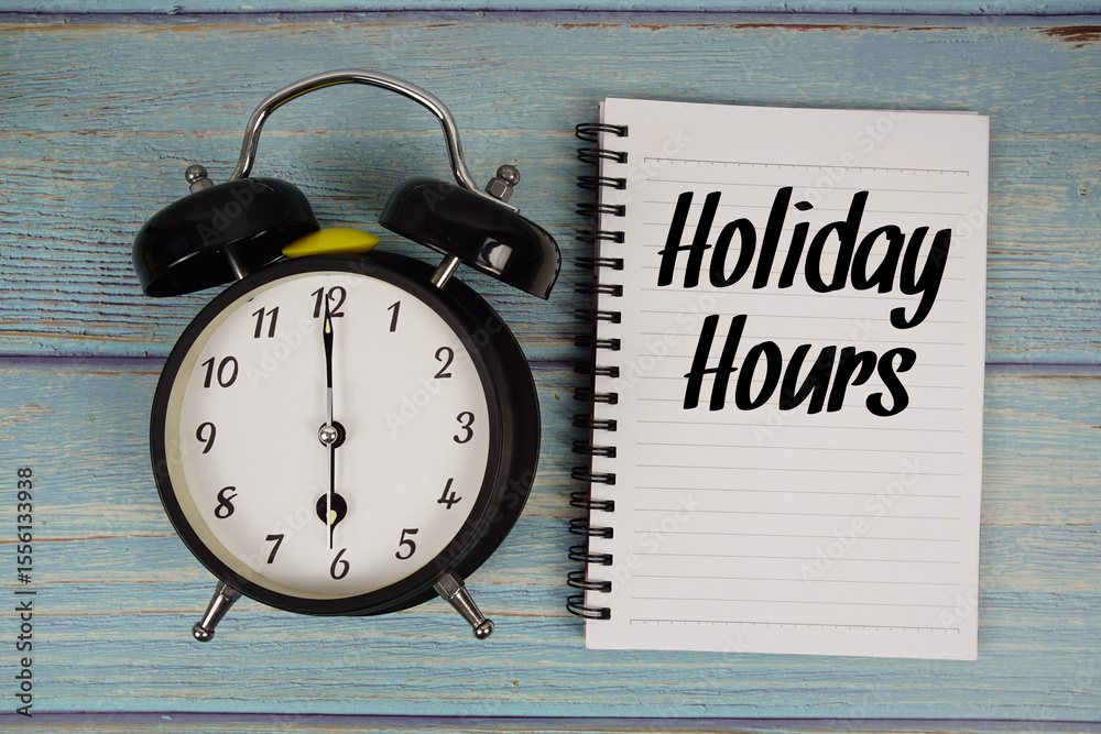 Fototapete holiday hours text written on notepad with alarm clock on wooden background