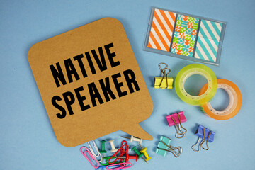 Native Speaker text with stationery on blue background