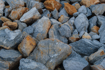Pile of Blue and Brown Rocks Displaying Natural Geological Patterns and Textures