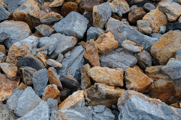 Pile of Blue and Brown Rocks Displaying Natural Geological Patterns and Textures