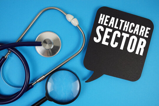 Healthcare Sector  text with Stethoscope and magnifying glass on blue background