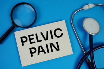 Pelvic Pain text with Stethoscope and magnifying glass on blue background