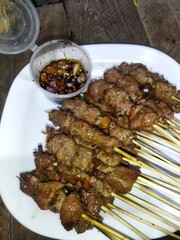 Cooking satay on Eid al-Adha