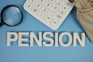 PENSION alphabet letters with magnifying glass and calculator on blue background