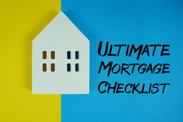 Ultimate Mortgage Checklist text with house models on blue background