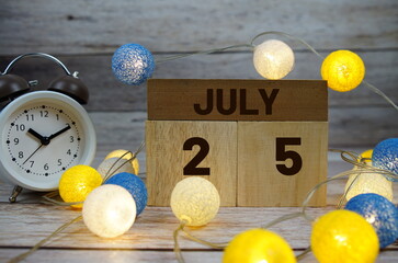 Wooden Calendar Showing the Date of July 25th. Day 25 of July month