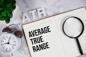 ATR - Average True Range acronym on notepad, Business concept background