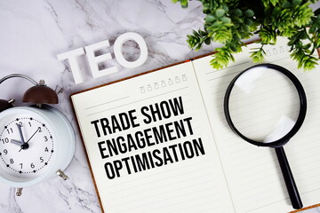 TEO - Trade Show Engagement Optimisation acronym on notepad, Business concept background