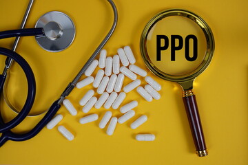 Preferred Provider Organization (PPO) text with magnifying glass and stethoscope on yellow...