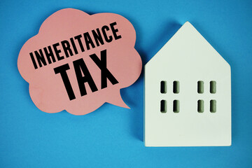 Inheritance Tax text message on speech bubble with house model on blue background
