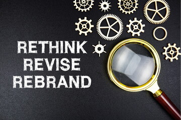 Rethink Revise Rebrand text message with magnifying glass on black background