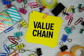 Value Chain text on stick note with stationery on concrete background