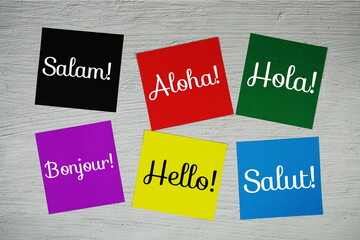 Hello in different languages text on stick note on concrete background © may1985