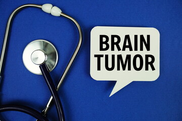 Brain Tumor text message on speech bubble with stethoscope on blue background