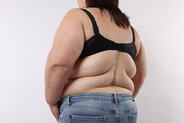Overweight woman on white background, closeup view
