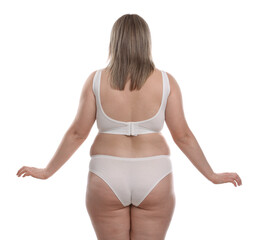 Weight loss. Plus size woman in underwear on white background, back view