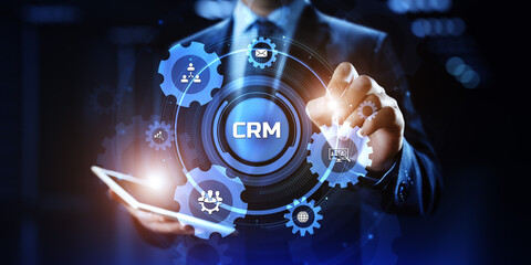 CRM Customer relationship management concept. Businessman pressing button on screen.