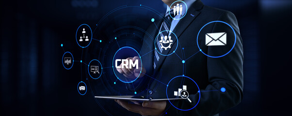 CRM Customer relationship management concept. Businessman pressing button on screen.