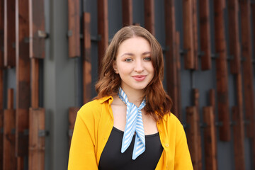 Portrait of teenage girl near building outdoors