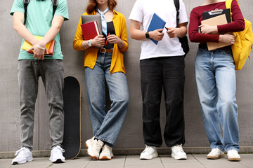 Group of teenagers posing near building outdoors, closeup
