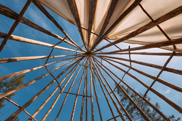 Fototapeta premium Traditional native teepee frame, bottom up view, wide angle.