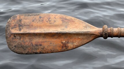 Rusty oar blade on water