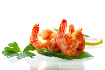 Cooking fried shrimps with aromatic spices and lemon isolated on white