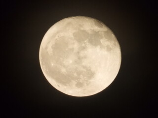 full moon over blue sky