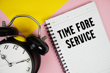 Time Fore Service text written on notepad with alarm clock on pink background