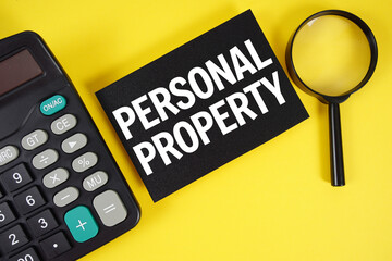 Personal Property text with magnifying glass anc calculator on yellow background
