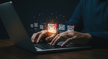 Person typing on laptop with glowing email notifications and digital sparks symbolizing communication