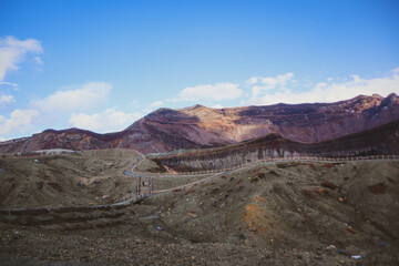 Fototapeta premium Mount Aso Crater Landscape under Blue Sky, Kyushu, Japan