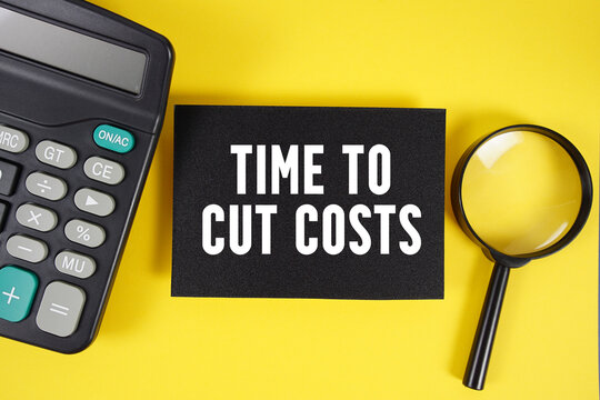 Time to Cut Costs text with magnifying glass anc calculator on yellow background
