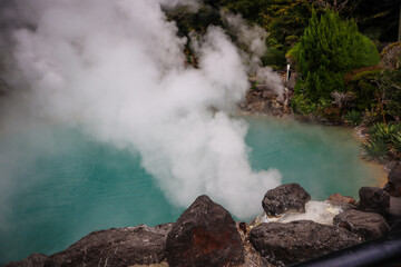 Thick Steam Rising from Natural Volcanic Onsen Pool in Japan