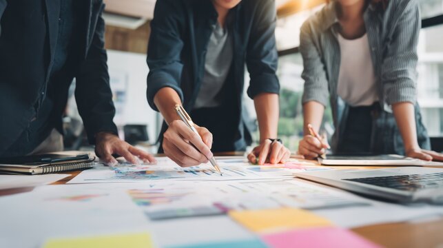 Business Team Collaborating on Financial Reports in Office Setting