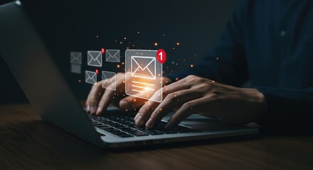 Person typing on laptop with glowing email notifications and digital communication icons