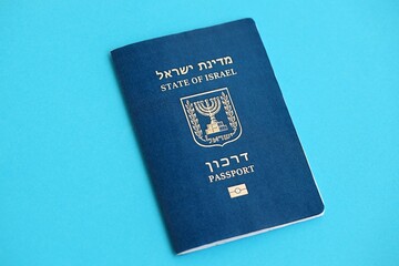 Israel passport on blue. The current Israel biometrical pass lies on blue background