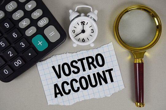 Vostro Account text with alarm clock, magnifying glass anc calculator on gray background