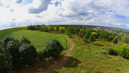 View from above. Flight on a quadcopter. Fields, forests and the city. Delight and freedom